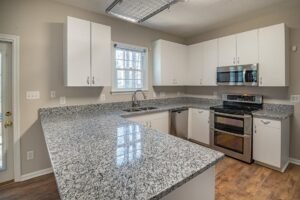 white cabinets with gray countertops 